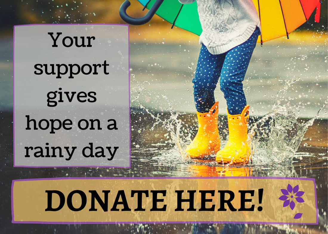 Child wearing colorful rain boots splashing in a puddle, your support gives hope on a rainy day. Donate here.